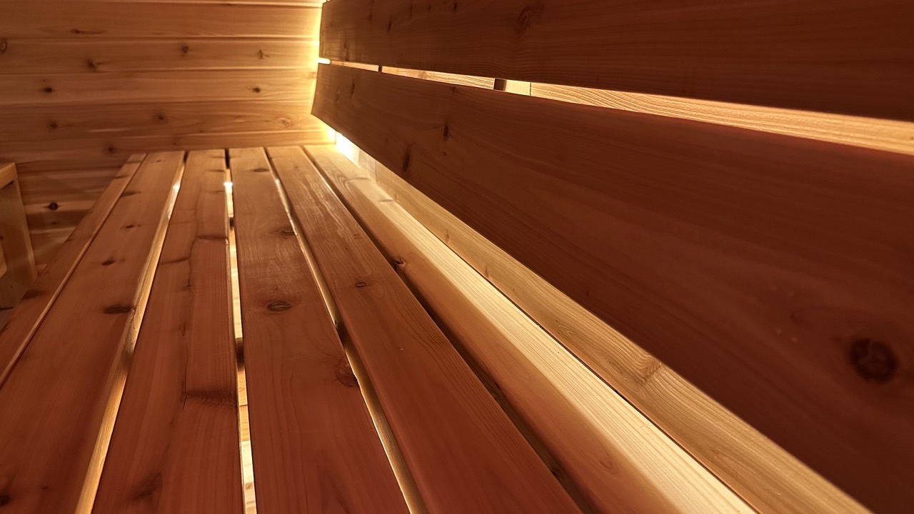 olished cedar wood panels with natural grains, creating a warm and welcoming visual for Bliss Mobile Sauna’s contact page