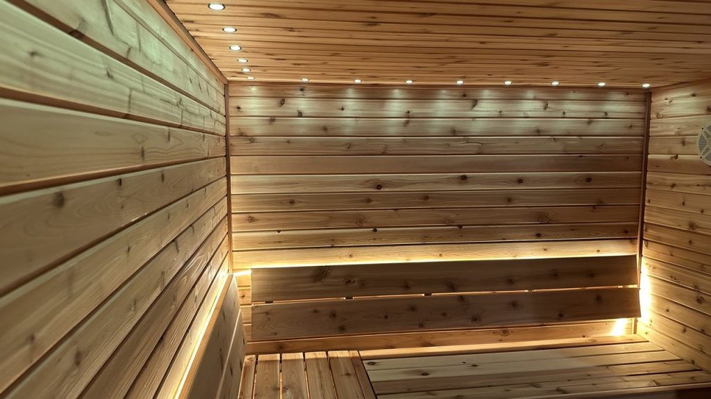 Premium cedar sauna interior from Bliss Mobile Sauna, featuring warm lighting and handcrafted wood.