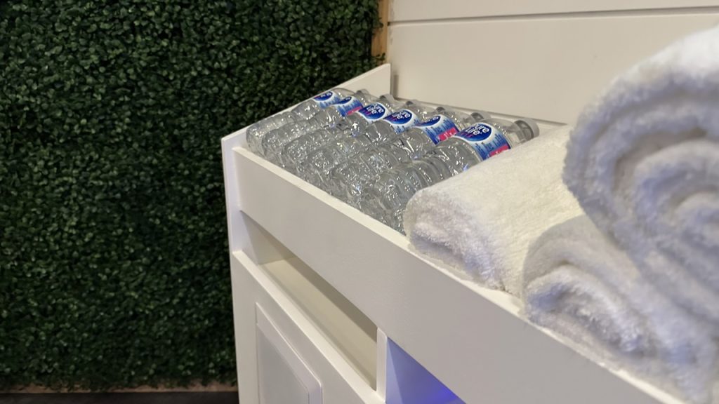 Relaxing lounge area with plush seating, offering a comfortable space to unwind between sauna sessions at Bliss Mobile Sauna