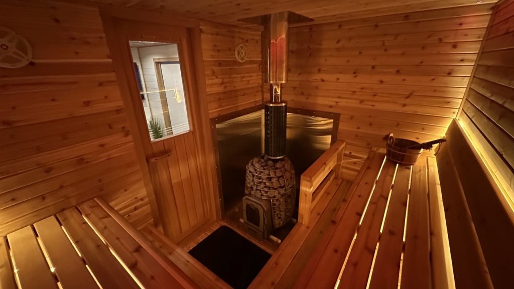 IMG_8256 Large Inviting cedar sauna interior with Bliss Mobile Sauna's signature, soft, warm, lighting for relaxation and comfort.